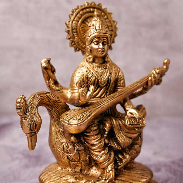 Brass Saraswati Idol | Sitting On Peacock | Gold | 17 cm