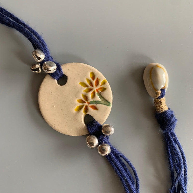 Rakhi For Bhai | Ceramic, Cotton Threads | White & Blue